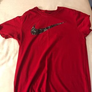 Red nike shirt with camo swoosh